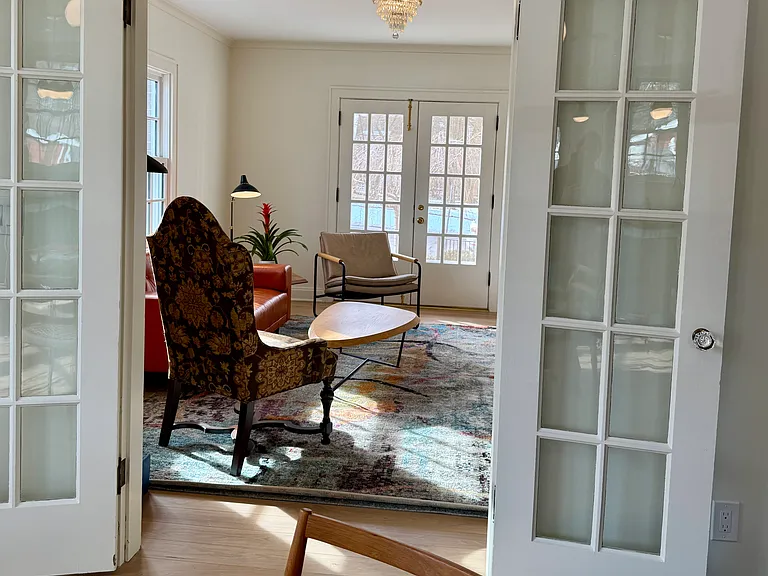 Looking through French doors into living area