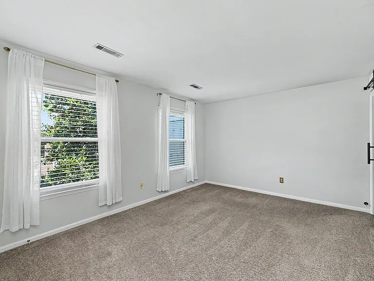 Primary bedroom with private ensuite bathroom with walk-in shower
