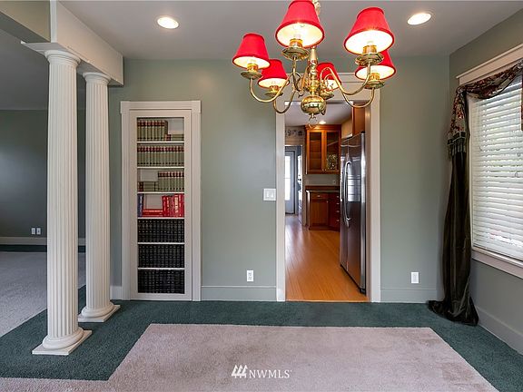 Nice sized dining room. Actual bookcase opens to stairs to basement.