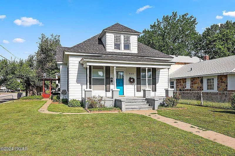 Front exterior view with deck off the side.