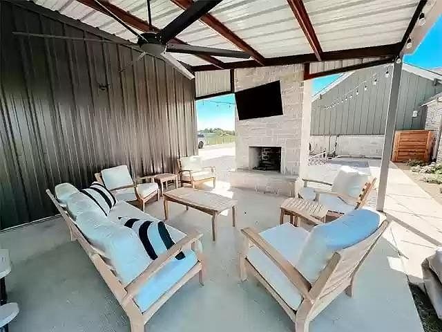 Shop has a new, massive outdoor living space with fireplace. Wired for wifi, sound and TV