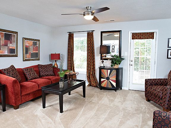 Spacious living room with door to private patio