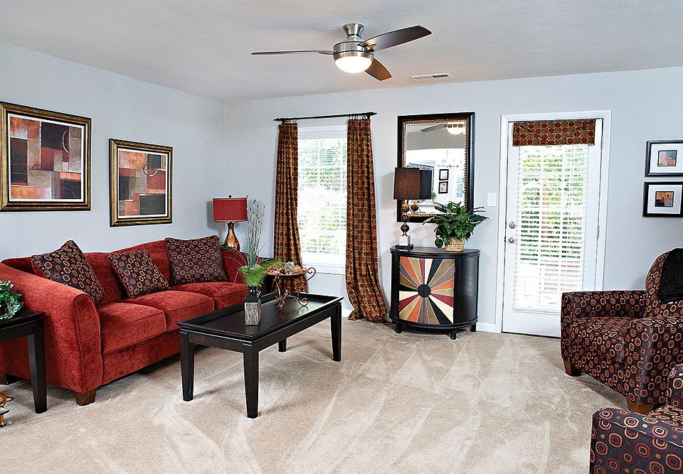 Spacious living room with door to private patio