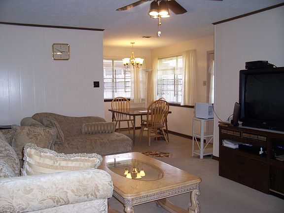Den opens to kitchen area