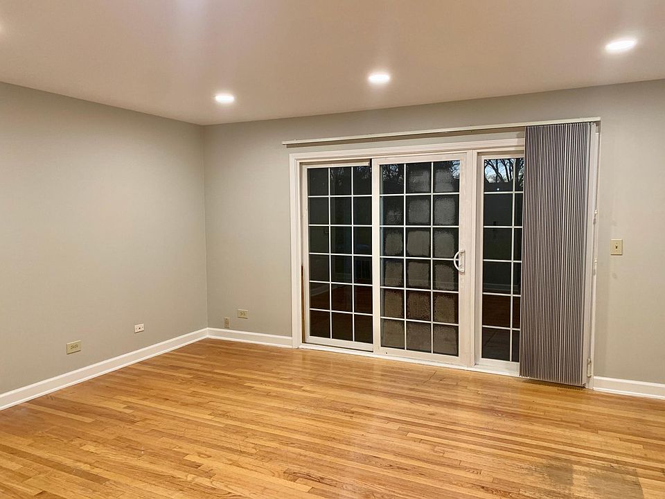 sunny living room with access to patio and courtyard