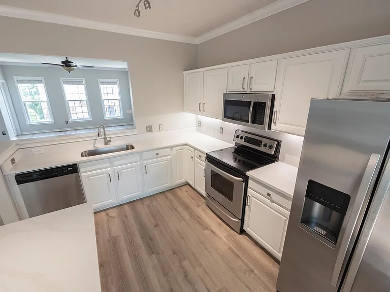 Brand new countertops and cabinet remodel. Wonderful veining included in the countertops as well with full stone backsplash