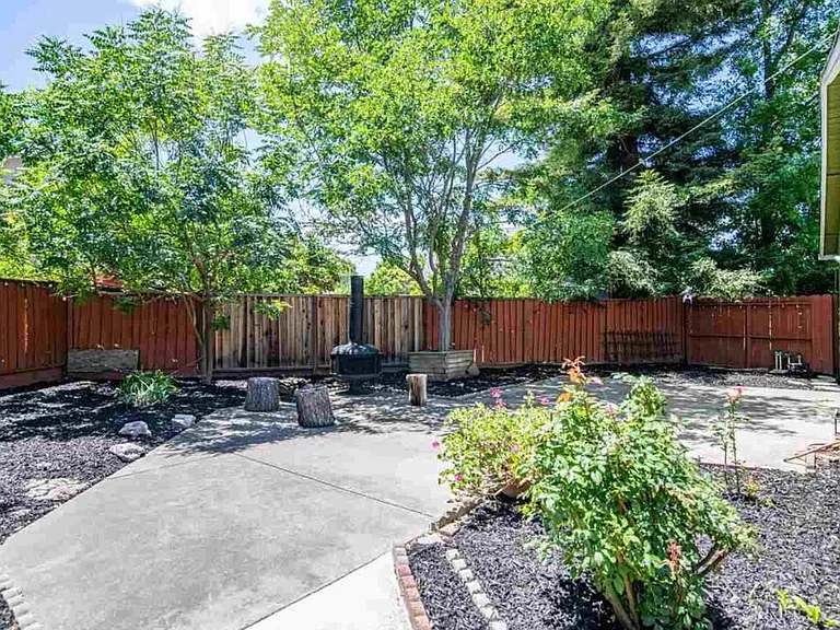 Outdoor fireplace & rose garden