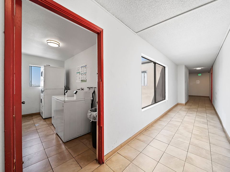 Clean, well-maintained hallway with easy access to on-site laundry facilities.