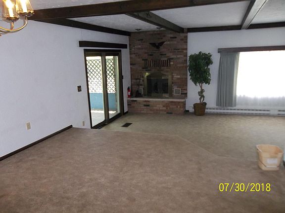 9 ft. Beamed ceiling Living room, fireplace with outside cl