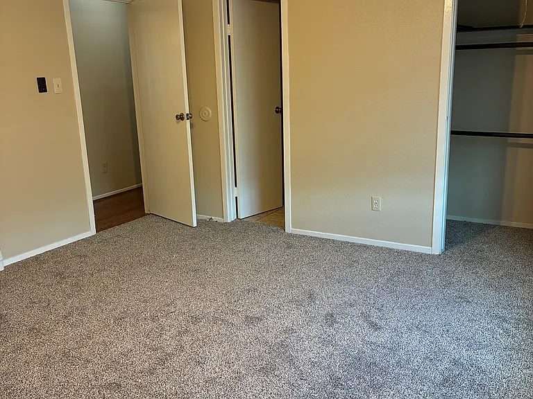 Upstairs master bedroom 2 (door to bathroom) with large closet and new ceiling fan