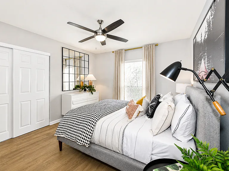 Spacious bedrooms with wood floors, large closets, and natural light throughout.