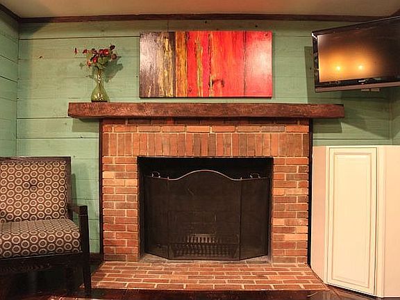 Kitchen wood burning fireplace/living area