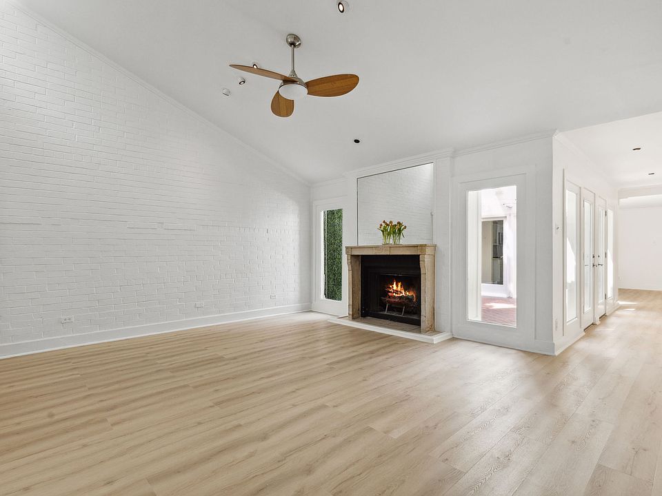 Living Room Entrance to Fireplace + Atrium Courtyard