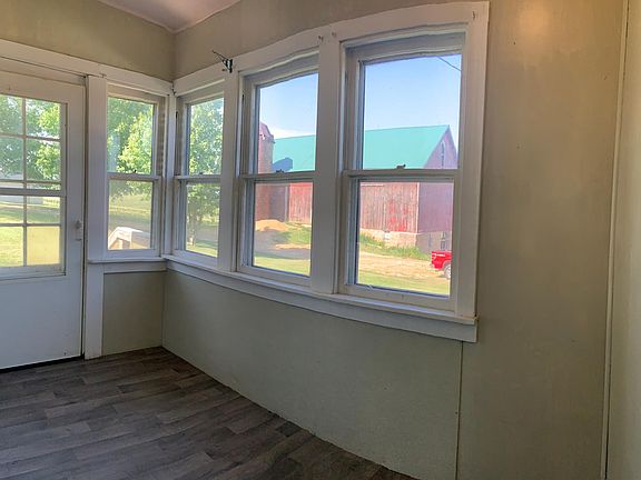 porch next to kitchen counter and cabinets