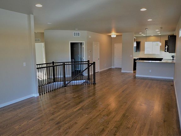 Main Level Great room looking towards the kitchen and front door.