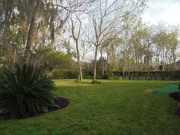 Wonderfully landscaped and spacious backyard! The
