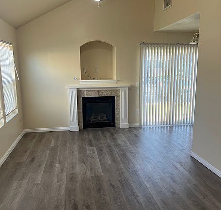 LIVING ROOM WITH CEILING FAN AND GAS FIREPLACE