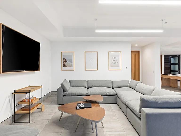 Comfortable and spacious lounging space equipped with Apple TV.