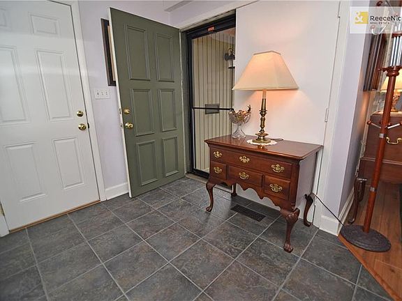 Double front door at entry and updated interior doors thru out. Tiled floor, all white trim and a coat closet