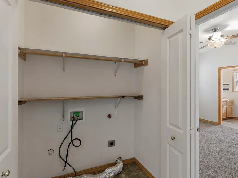 Utility Closet - Bring your own Washer and Dryer. Lots of shelves for storage. Conveniently located by the master bedroom.