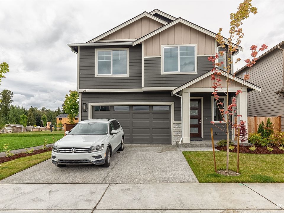 Photo is of the Model Home on Lot 1, the 2535 Sierra plan.  May depict enhancements and / or upgrades that are not available with every plan.>