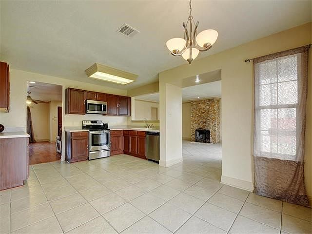 Kitchen complete with stainless appliances.