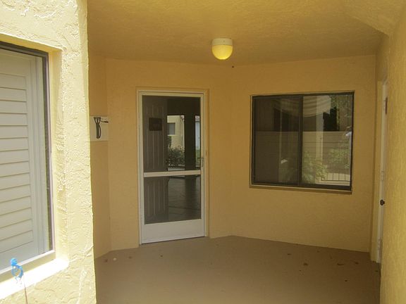 Covered entrance way to P-104. Large storage closet on right hand side.