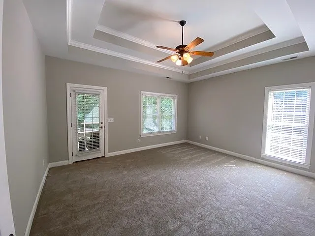 Main bedroom with trey ceilings. Private access leading onto the back deck
