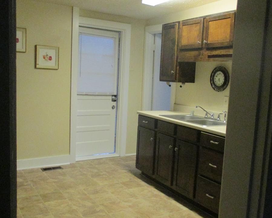 kitchen and backdoor leading to the sunroom