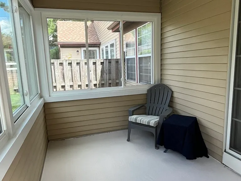 Bright Four-Season Sunroom 
The enclosed four-season sunroom is one of the home's standout features_perfect for morning coffee, reading, puzzles, or simply relaxing while enjoying peaceful garden views in every season.