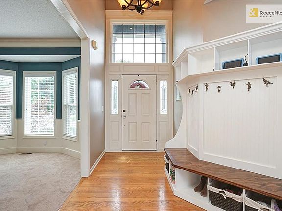 Custom Hall Tree by McQuillen Designs. Includes hooks, cubbies, bench & charging stations!