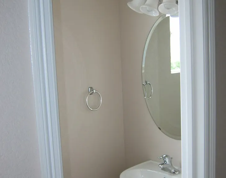 First floor half bath between kitchen and laundry room.