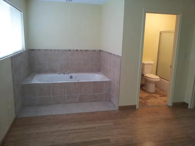 bedroom #5 with Jacuzzi tub and bath