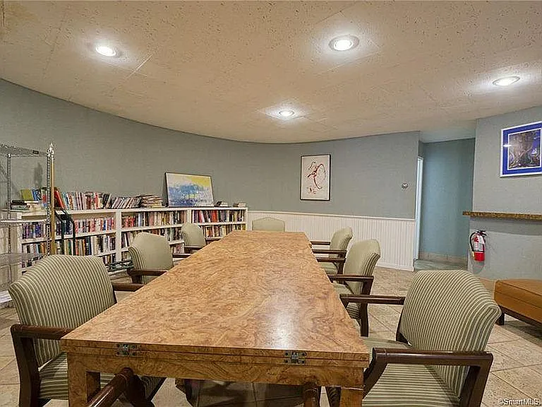 Communal library at the lobby or waiting room with 2 restrooms for guests.
