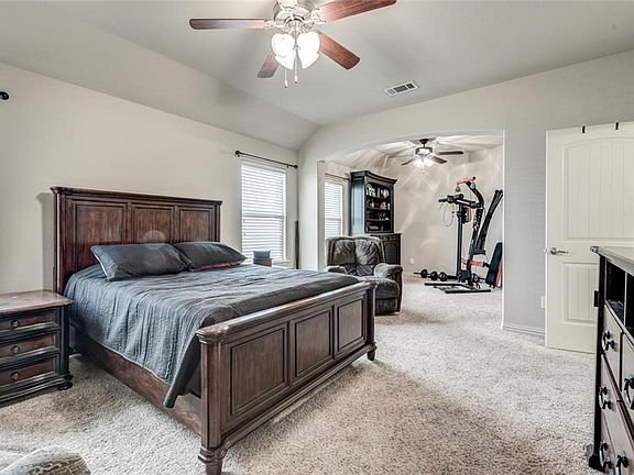 Master suite offers a sitting area that provides a great space for relaxing or exercising! Lots of space!  Vaulted ceilings, ceiling fans, Berber Frieze carpet and lots of natural light.