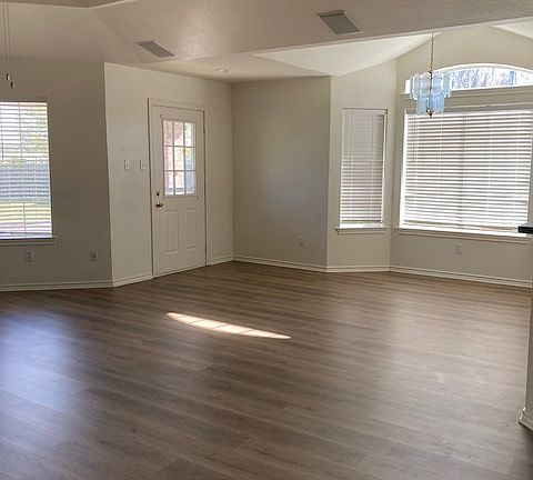 Living Rm - Right side. Room for dining table in bay window.