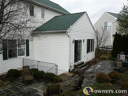 Rear patio and steps to basement