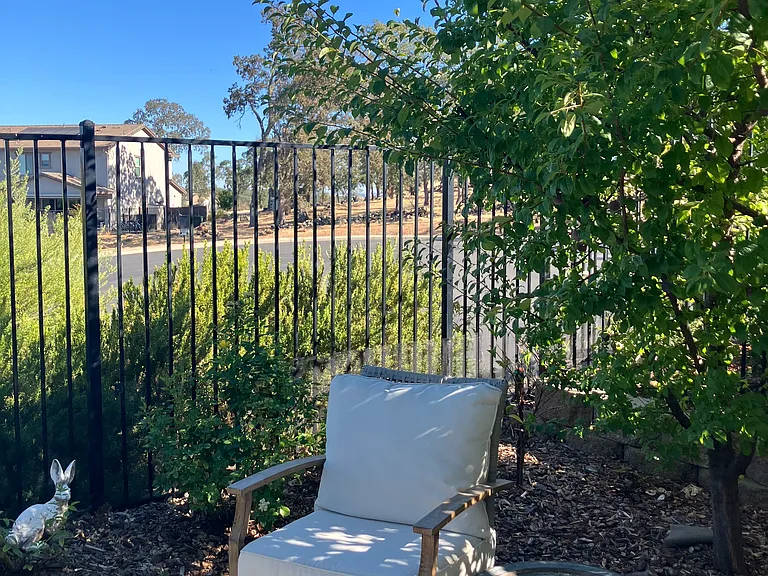 The backyard has a view of the open space and a peek of Folsom Lake.