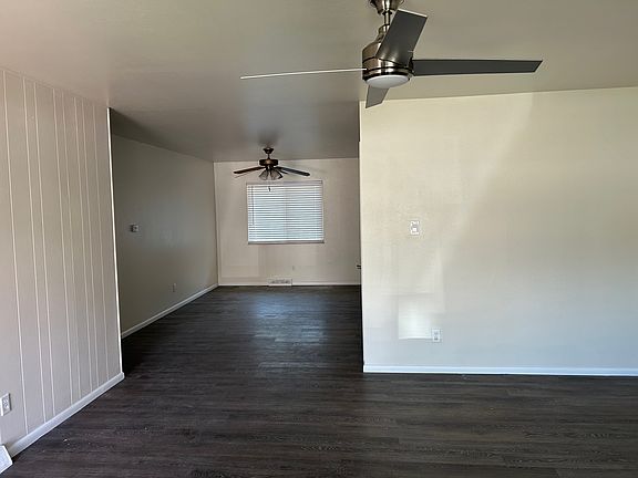 Living & dining rooms. Both have ceiling fans.