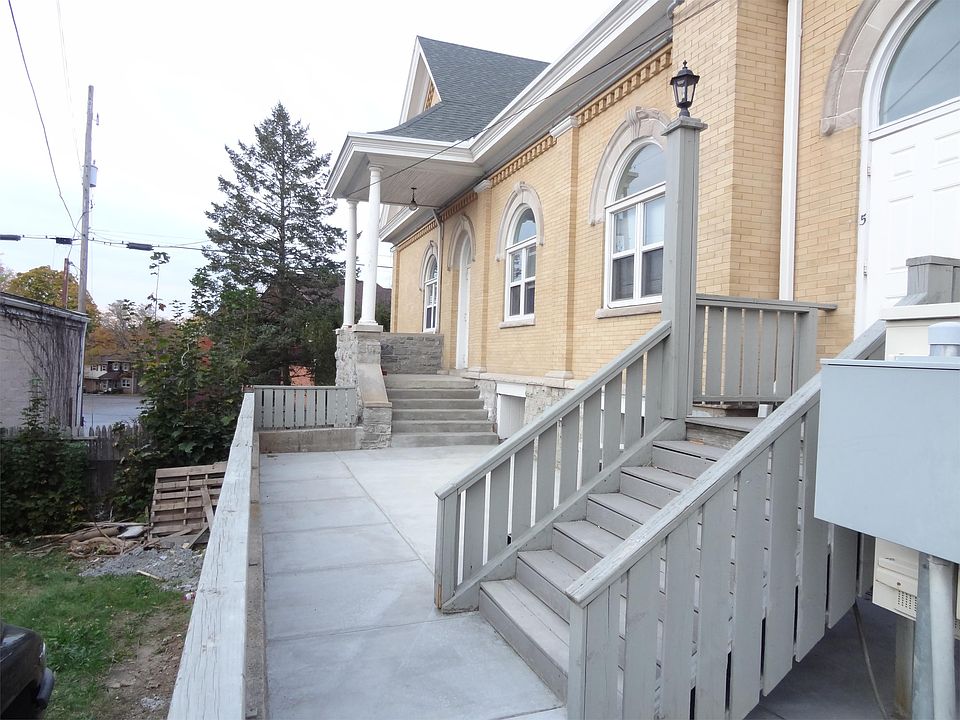 View of patio on side of building accessible to unit 13