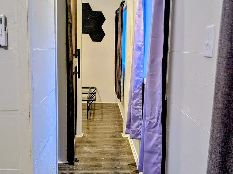 Hallway from kitchen area to the bathroom and bedroom.