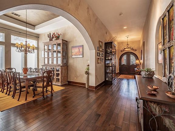 Grand 32x7 foyer with beautiful hardwood flooring.