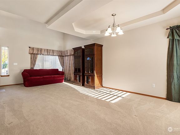 Coved ceilings in the dining area add a designer touch to this wonderful living area>