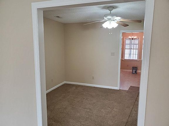 Dining room leads to kitchen