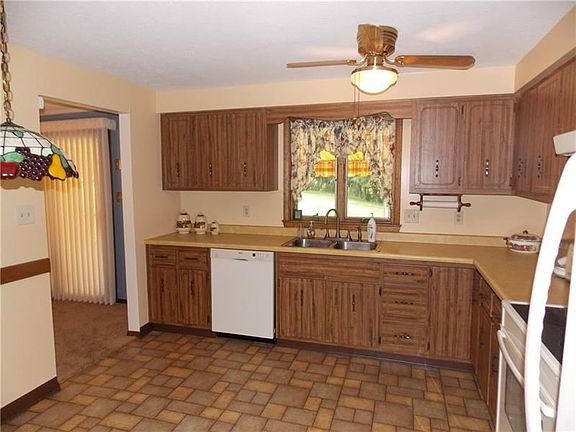 The kitchen is an Eat In kitchen with Bosch dishwasher, electric stove, garbage disposal and fridge.  The window to the rear yar