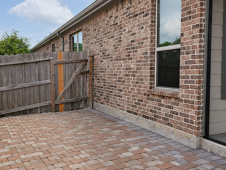 Private paved patio space perfect for extending gatherings with family and friends outdoors