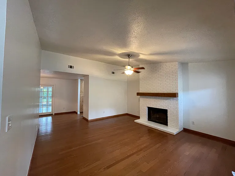Living room which leads to dining room, kitchen and sunroom