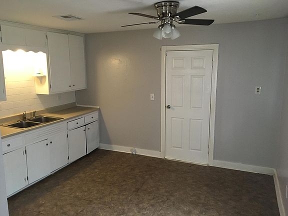 kitchen with door to laundry room.