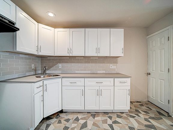 Kitchen includes a stove and fridge
