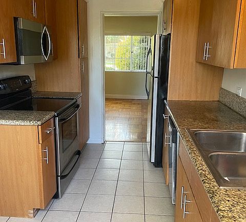 Galley kitchen fits cafe table and two chairs